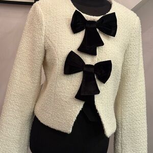Dolce Cabo Ivory Textured tweed Jacket w/ black velvet bows.  Size M. Never worn